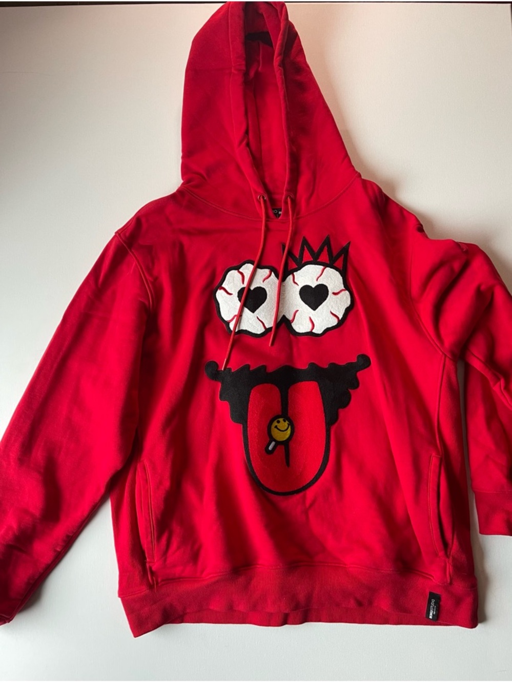Red Graphic Pullover Hoodie with Playful Face Motif